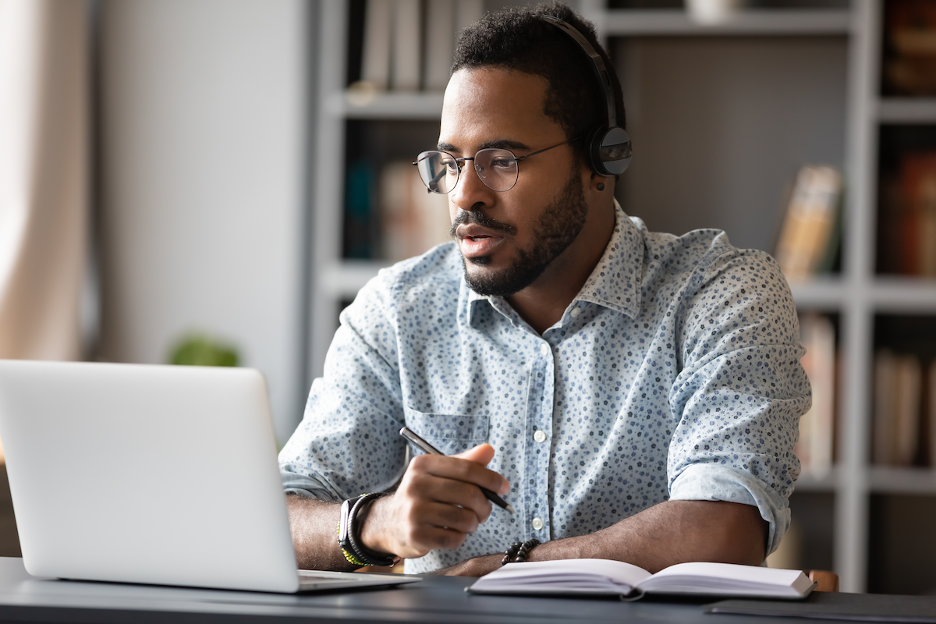 image-photofocused-young-african-businessman-wear-headphones-remote-work-IT-help-desk-support